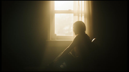 women sitting by the window contemplating why no contact feels worse before it gets better.