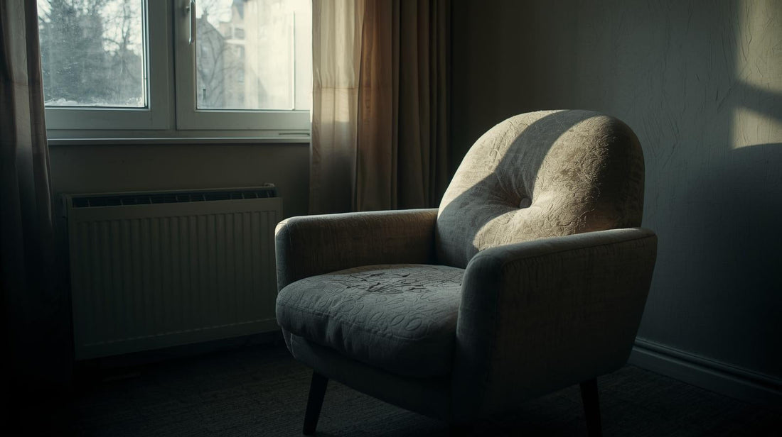 Worn armchair with visible indentation in cushion in quiet living room
