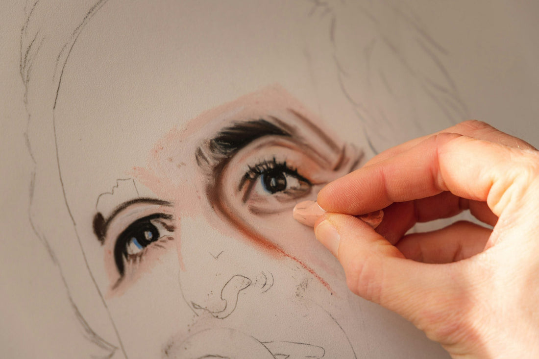 Artist shading a detailed portrait by hand, representing the creation of a personalized soulmate sketch.