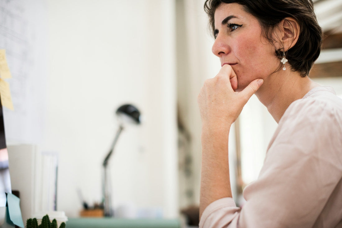 Woman reflecting on whether her relationship can survive cheating and rebuild trust after betrayal