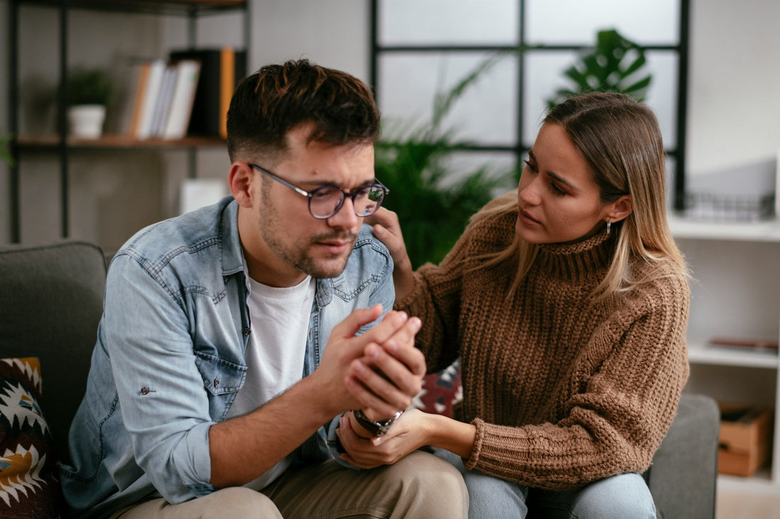 Woman comforting her distressed partner while they discuss how OCD affects their relationship