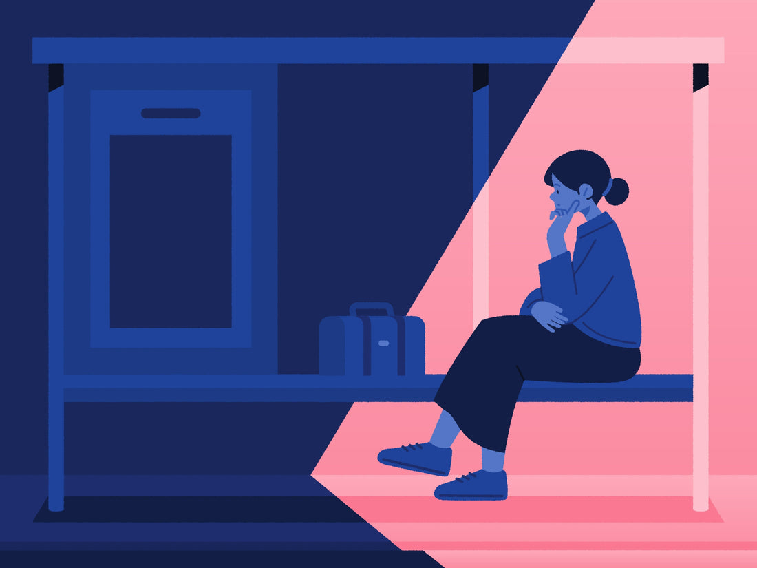 Woman looking thoughtfully out of a window, reflecting on whether an avoidant ex misses her after the breakup.