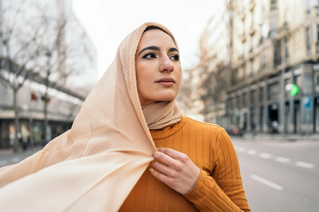 Muslim woman walking alone through a city while reflecting on whether missing someone means they were meant for her.