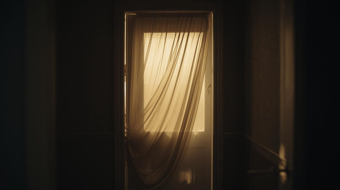 Interior doorway partially covered by a sheer curtain in soft light, symbolizing an undefined or unfinished connection