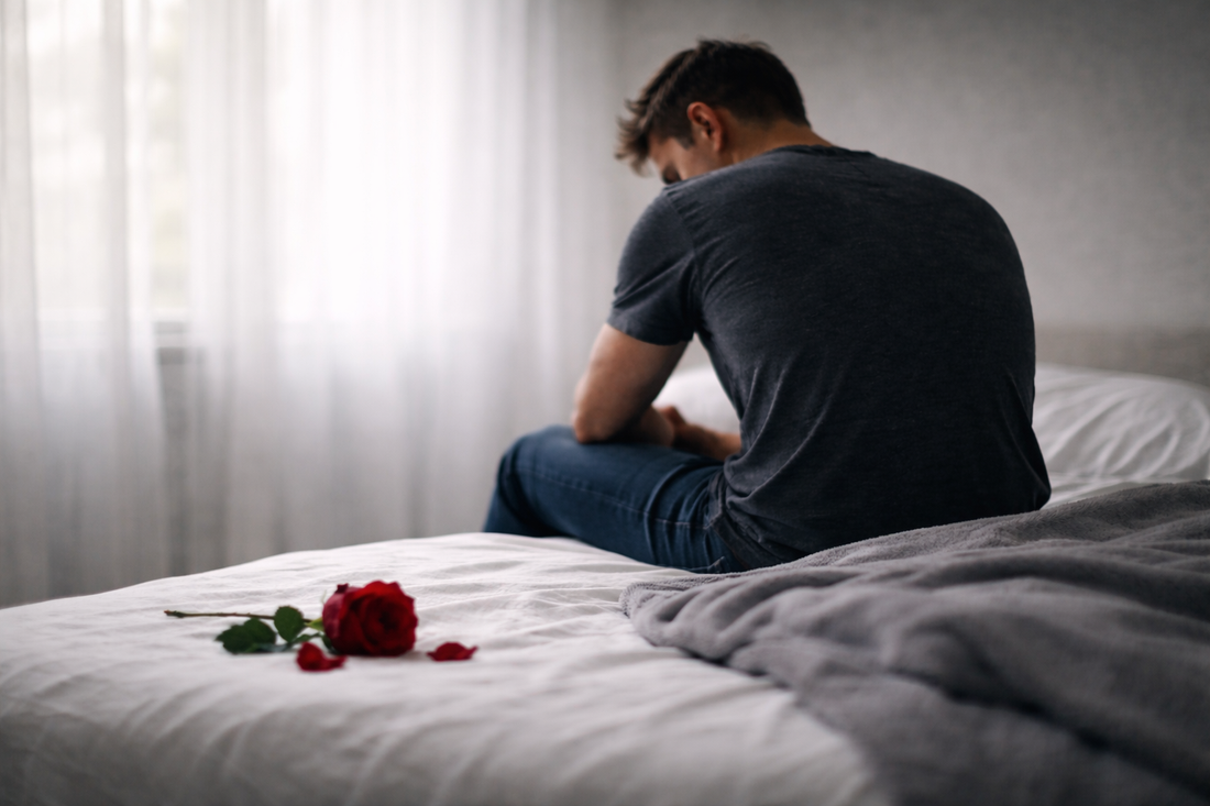 Man sitting alone after a long-term breakup, reflecting on an ex who married someone else quickly