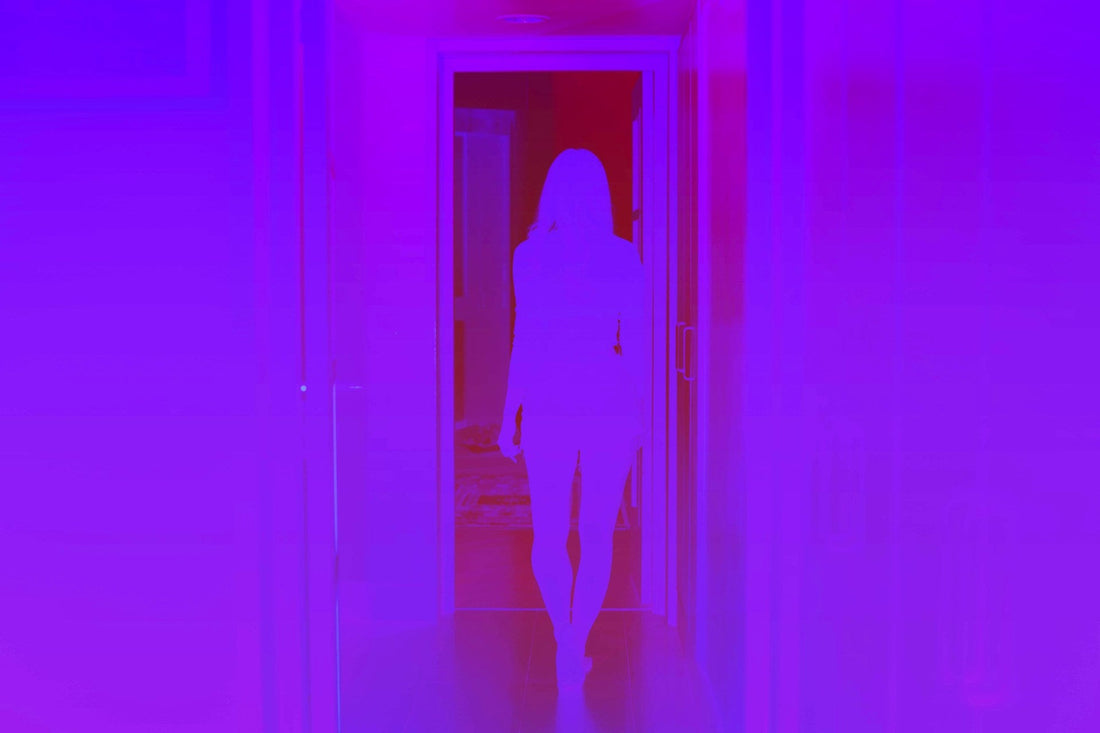 Woman walking through a doorway, symbolising forgiveness while choosing distance and limiting continued access
