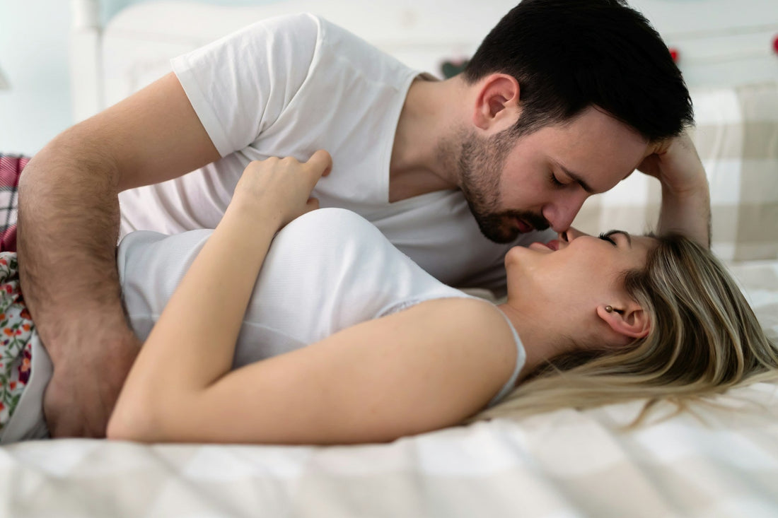 Former couple sharing an intimate moment in bed after a breakup, reflecting physical attachment and blurred emotional boundaries.