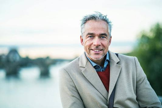 Man considering whether a hair transplant is worth the cost and long-term commitment