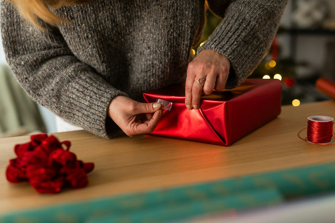 Woman wrapping a thoughtful gift to send to her long-distance boyfriend