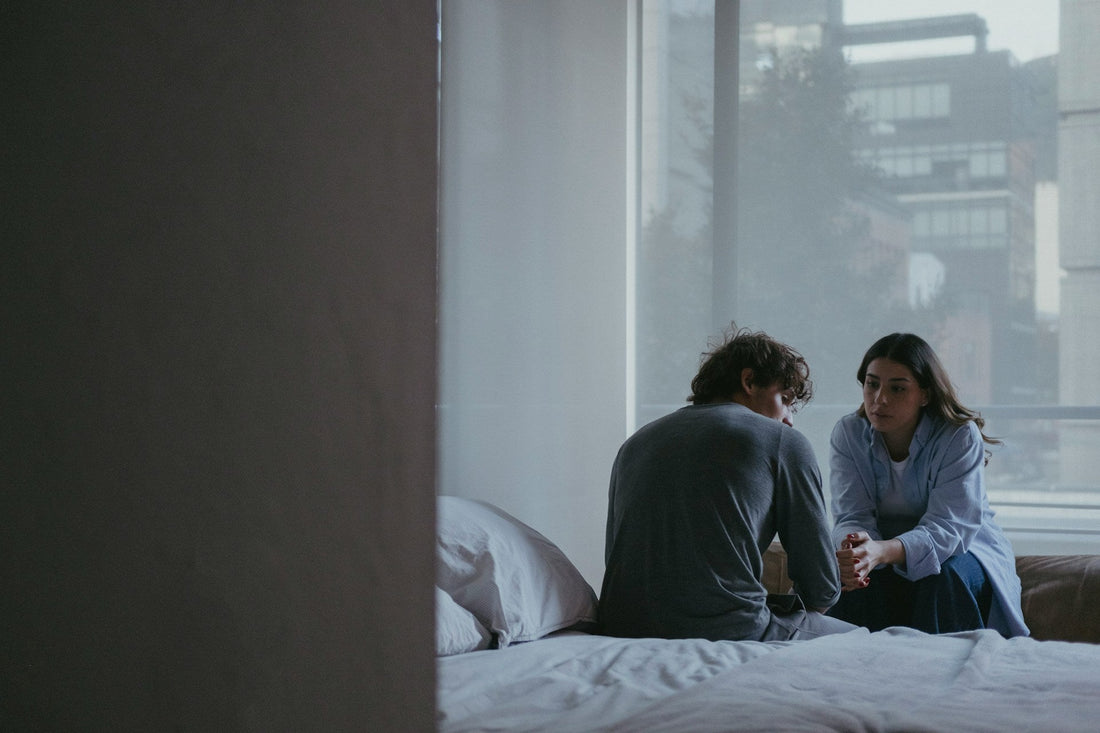Relaxed couple sharing affection while reflecting on how often couples normally have sex