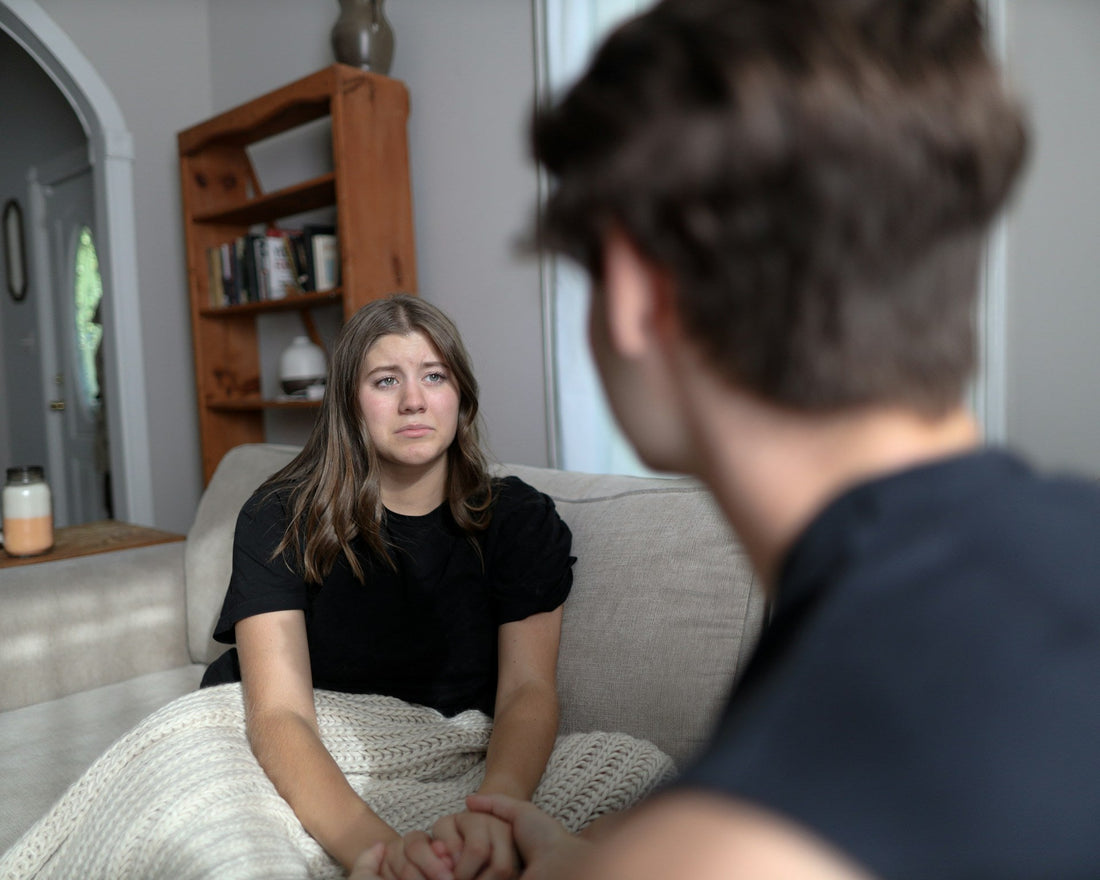 Couple having a calm conversation, representing how to communicate without starting a fight