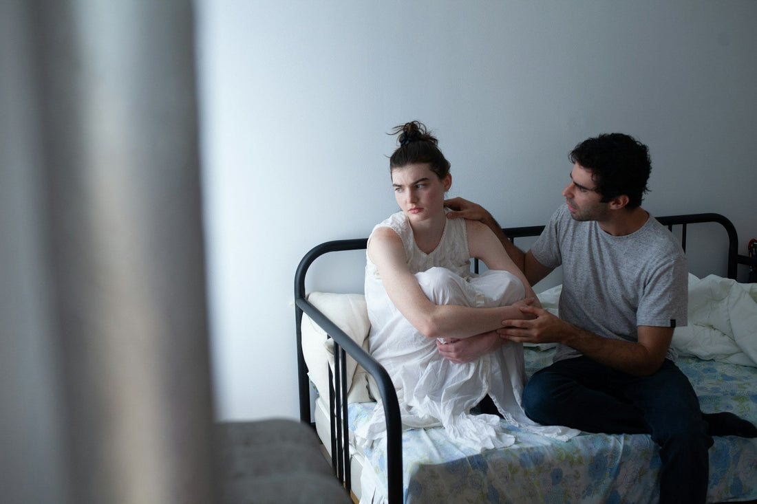 Partner offering comfort and emotional support to a woman who feels like a burden in their relationship