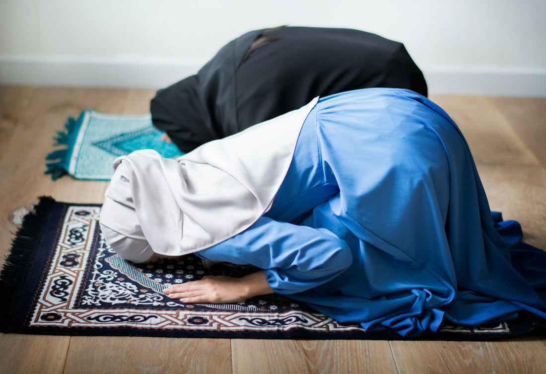 Muslim women in sujood during prayer, representing tawbah, spiritual healing and continuing to miss someone after ending a relationship.