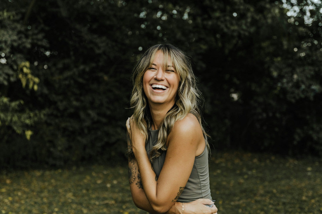 a woman with a smile on her face loving her single life