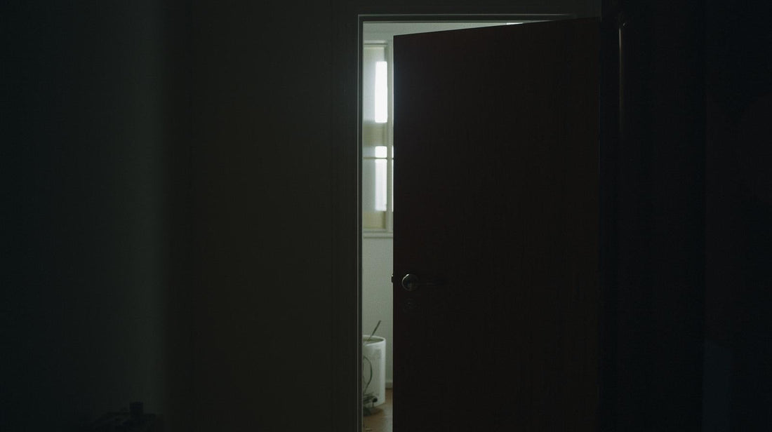 Partially open door with obstruction symbolizing simultaneous desire and fear of intimacy