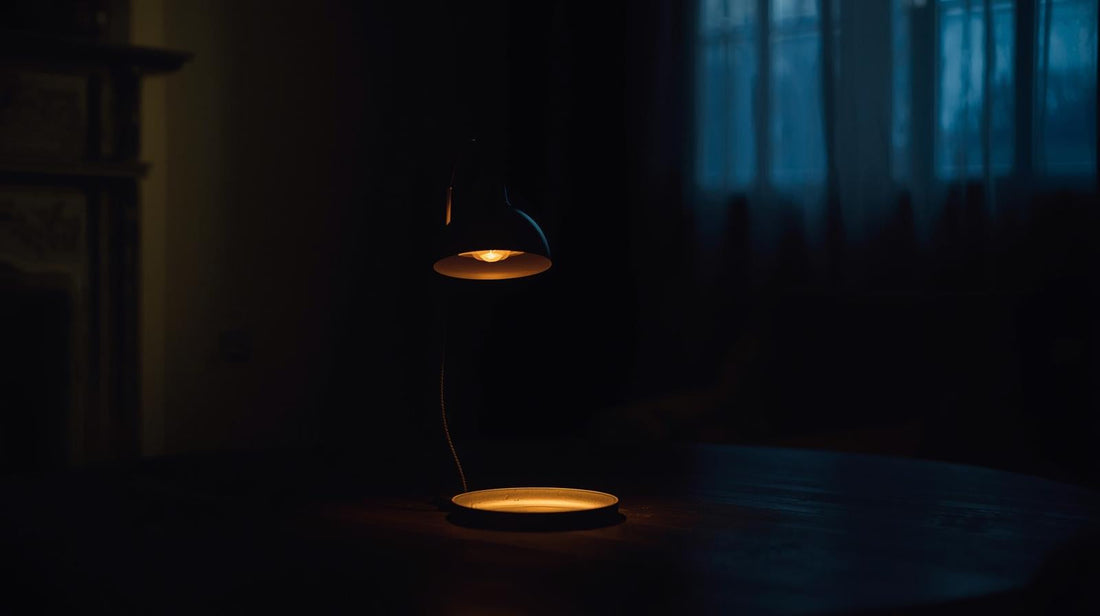 Single lamp glowing in dim room symbolizing intermittent emotional reward