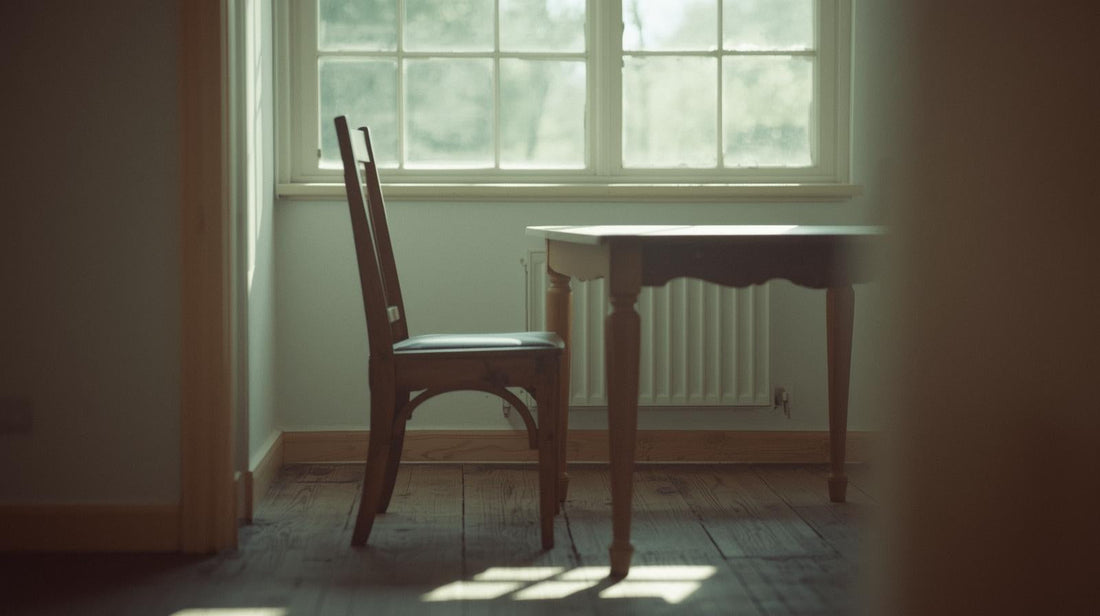 Empty chair in soft light symbolizing silence after breakup