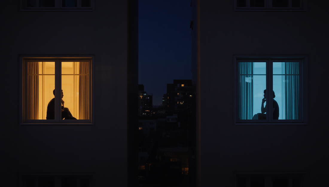 Two people awake in separate apartment windows at night, representing miscommunication in a long-distance relationship.