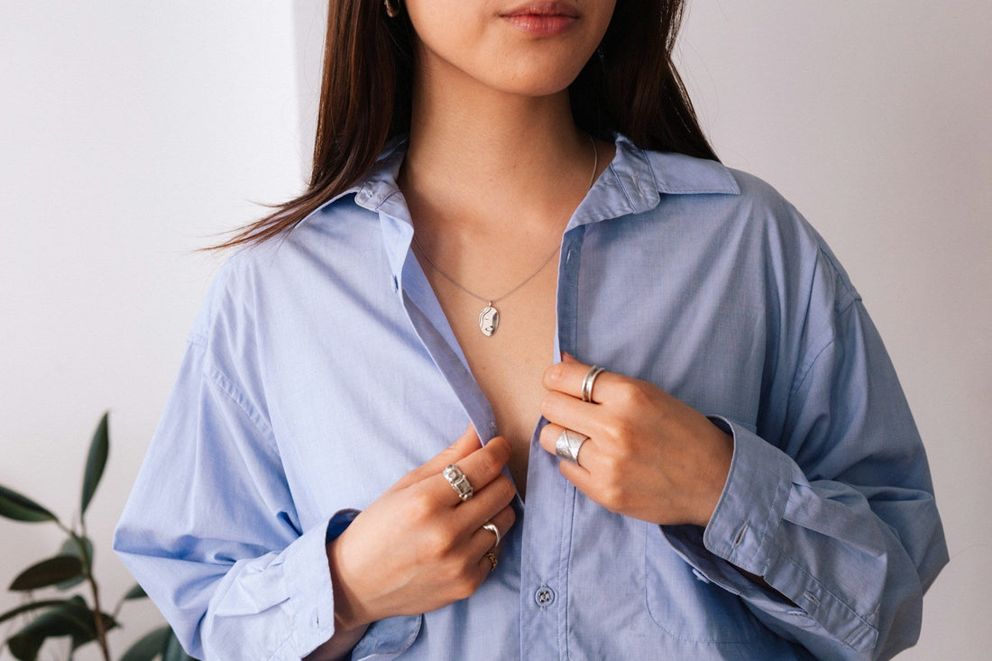 woman wearing a long distance relationsip necklace