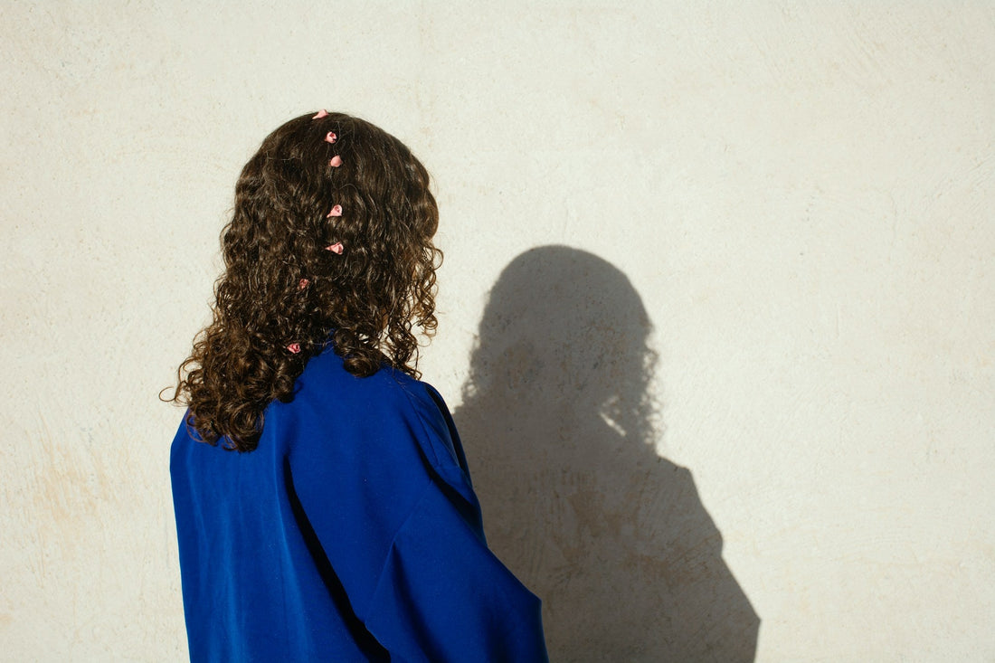 Person feeling disconnected from themselves in a relationship, representing the gradual loss of identity and personal needs