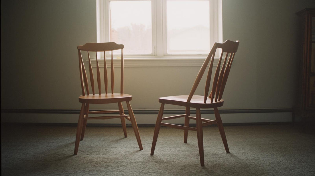 Two chairs placed close together but angled slightly apart, symbolizing an avoidant push–pull relationship dynamic