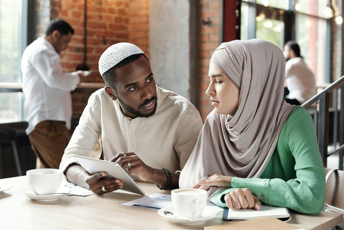 Muslim couple having a serious premarital conversation while reviewing concerns and relationship red flags before nikah.
