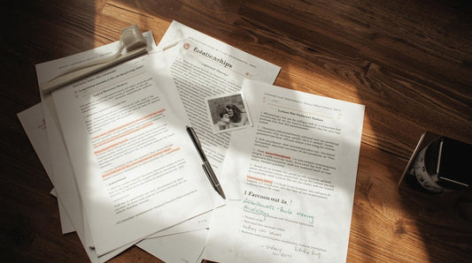 relationship psychology study notes and charts with symbolic red thread connecting two paper hearts