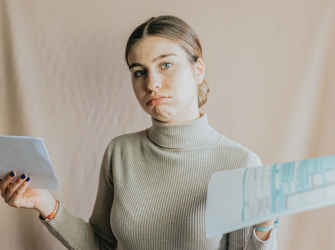 Woman holding a breakup letter and deciding whether to send it to her ex