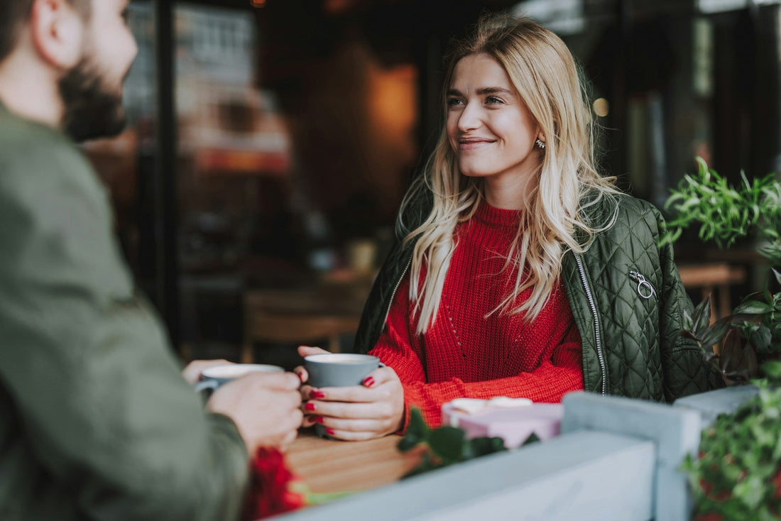 Couple sharing coffee on an early date, representing why dating again can feel strange after a long relationship and the adjustment to meeting someone new.