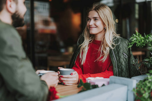 Couple sharing coffee on an early date, representing why dating again can feel strange after a long relationship and the adjustment to meeting someone new.