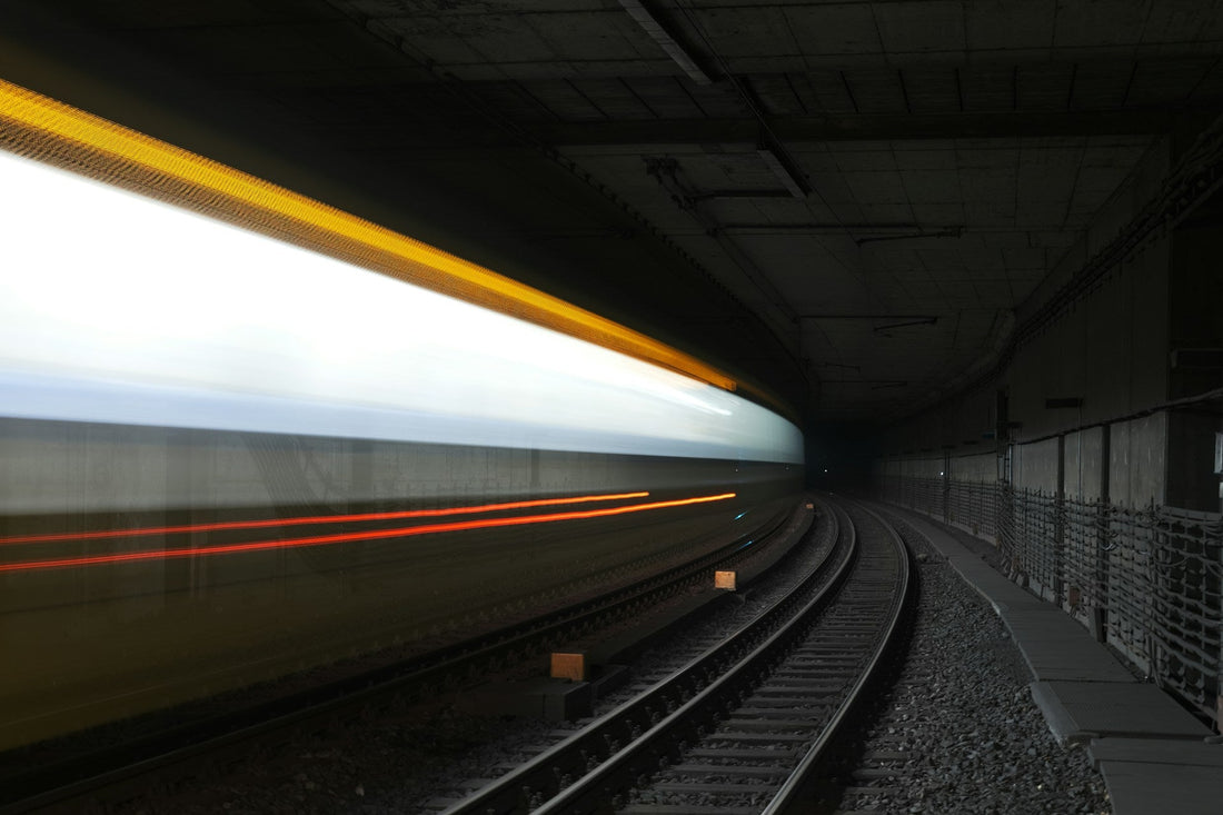Fast-moving train through a dark tunnel, symbolising the speed and intensity of a rapidly developing gay relationship.