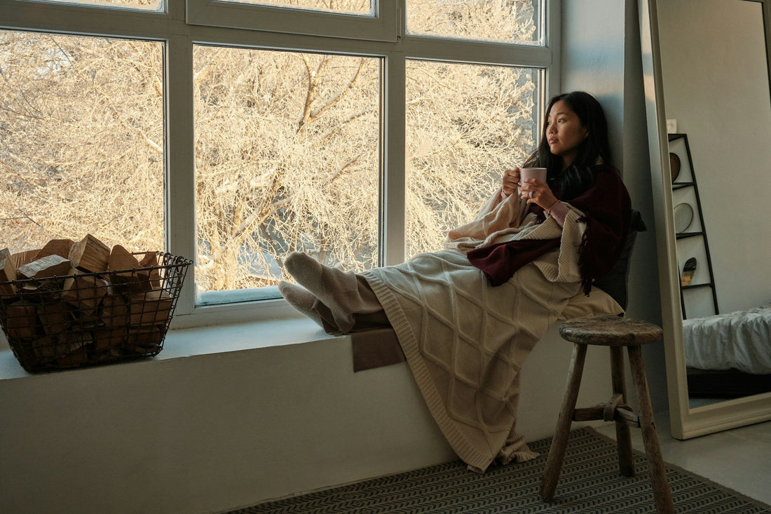 woman sitting comfortably at home not quite ready for a new relationship
