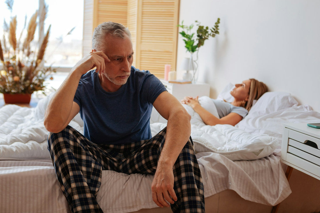 Midlife woman experiencing painful sex after menopause while talking with her partner