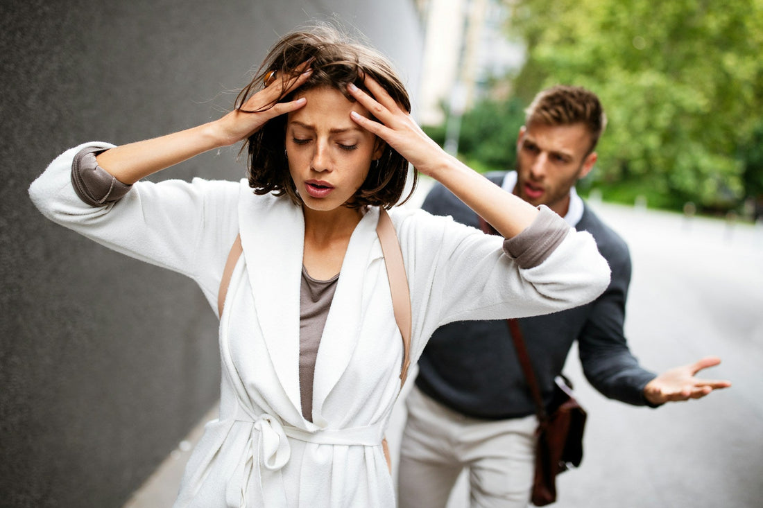 Distressed woman pulling away while her partner argues behind her, symbolising how emotional distance can make the consequences of disrespect feel real