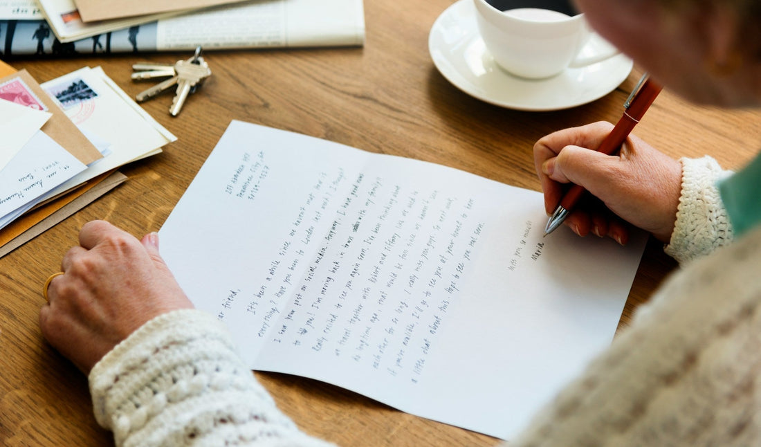Person writing a private unsent breakup letter by hand to help process feelings and let go
