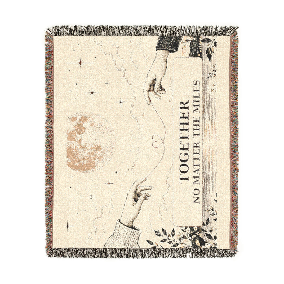 A square woven throw blanket with fringe edges, featuring a celestial design with stars, a moon, two reaching hands, and the text 'TOGETHER NO MATTER THE MILES' on a cream background.