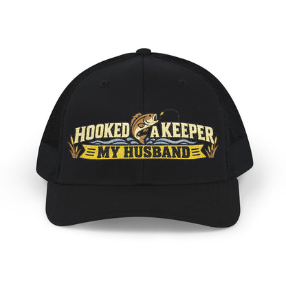 Black cap with hooked a keeper  logo on a with a fisher motif.