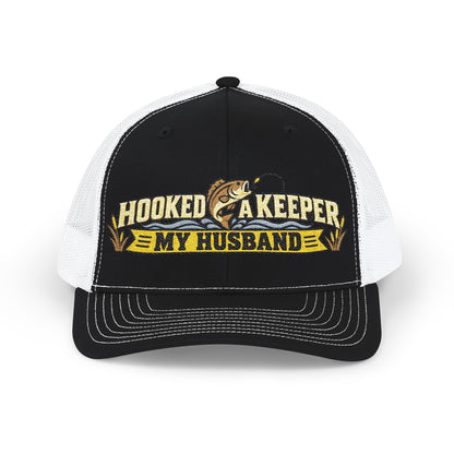 Black cap with hooked a keeper  logo on a with a fisher motif.