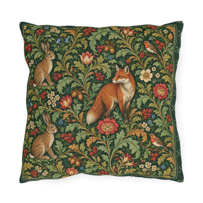 A square decorative throw pillow featuring a detailed, classic-style woodland tapestry pattern with a fox, rabbits, birds, and flowers on a dark green background.