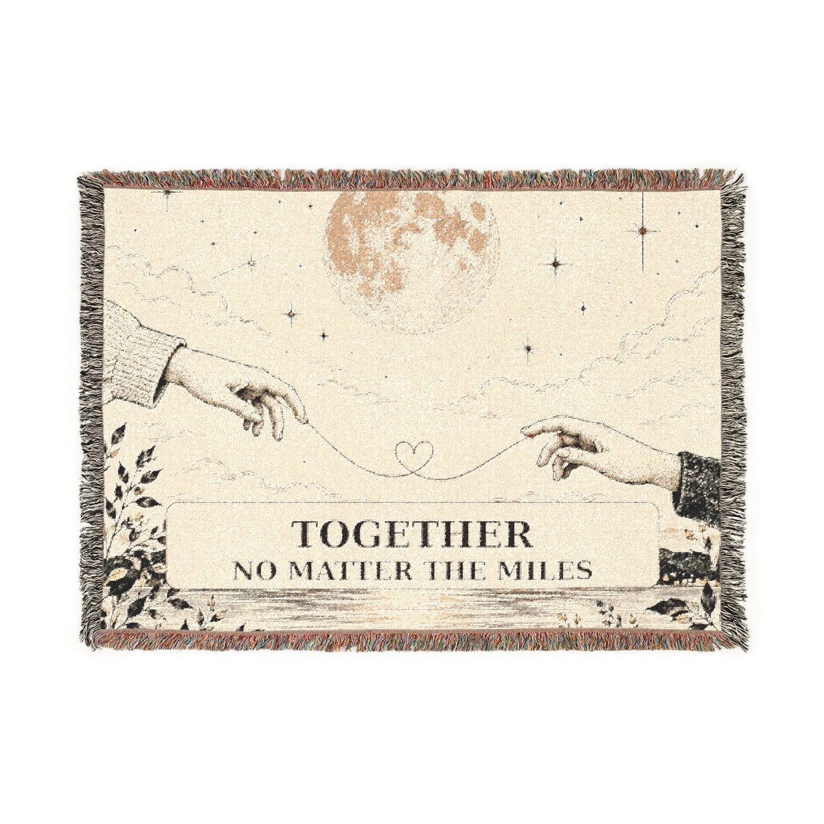 A rectangular woven throw blanket with fringe edges, featuring an illustrated celestial scene with two reaching hands, stars, a moon, and the text 'TOGETHER NO MATTER THE MILES' on a cream background.
