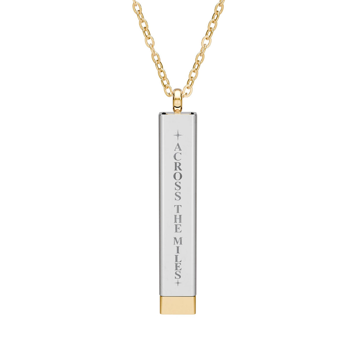 A gold and silver bar pendant necklace engraved with the vertical text 'ACROSS THE MILES' on a clean white background.