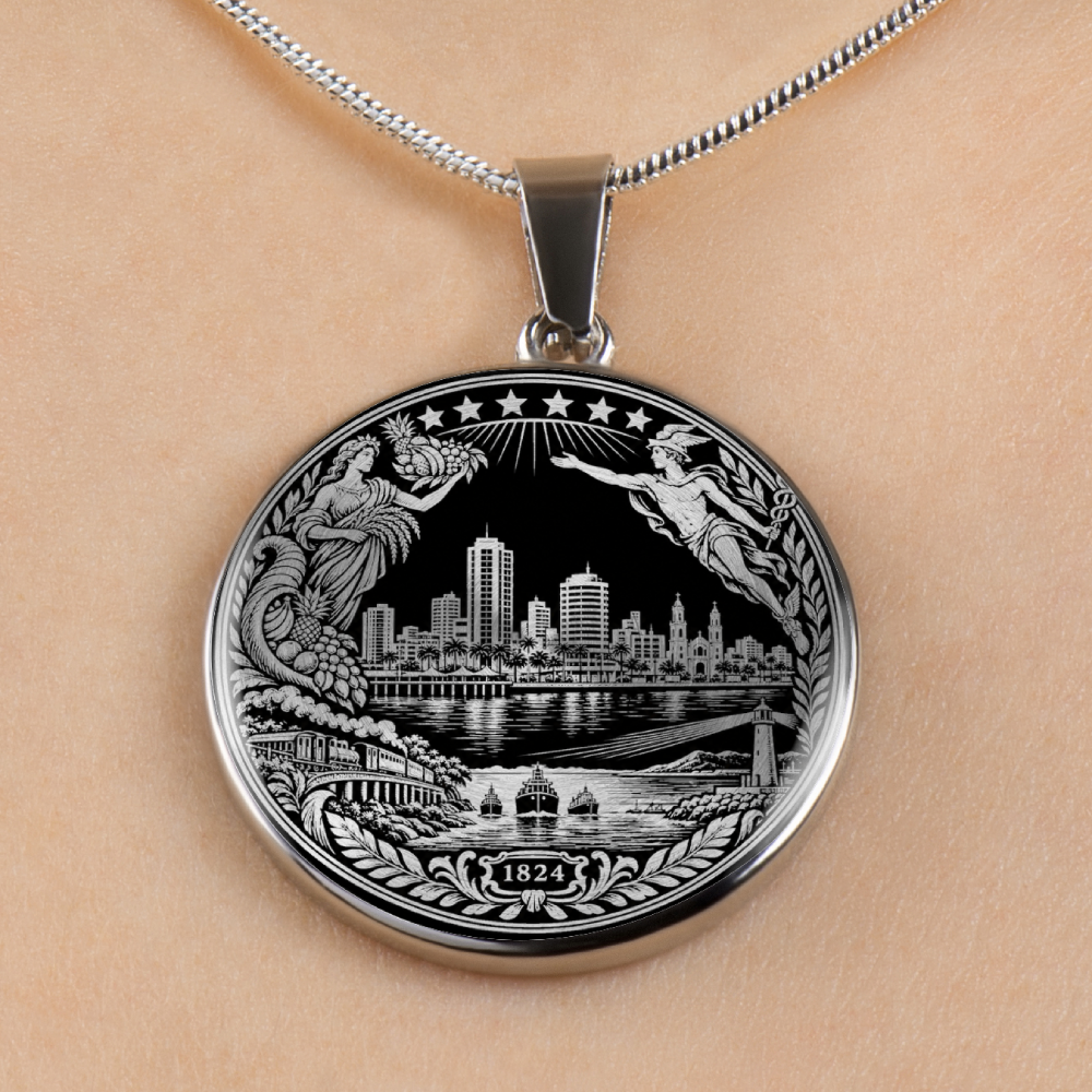 A silver round pendant necklace featuring an engraved black and white city machala skyline design with classical figures and decorative borders, shown worn on a person's neck against a light skin tone background.