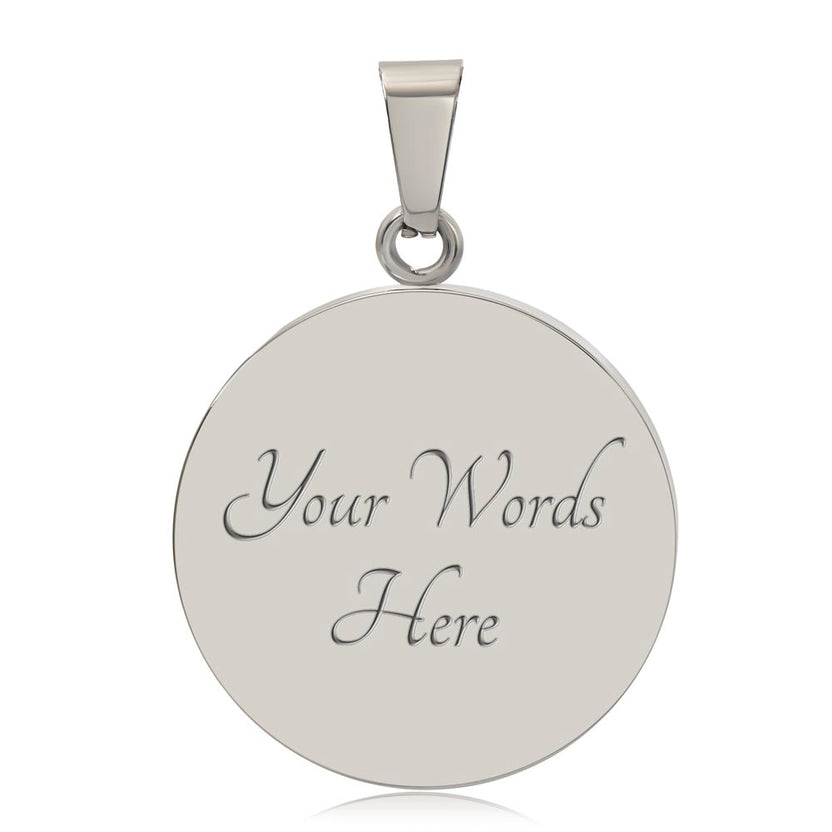 Close-up of silver circular pendant back displaying example Your Words Here engraving