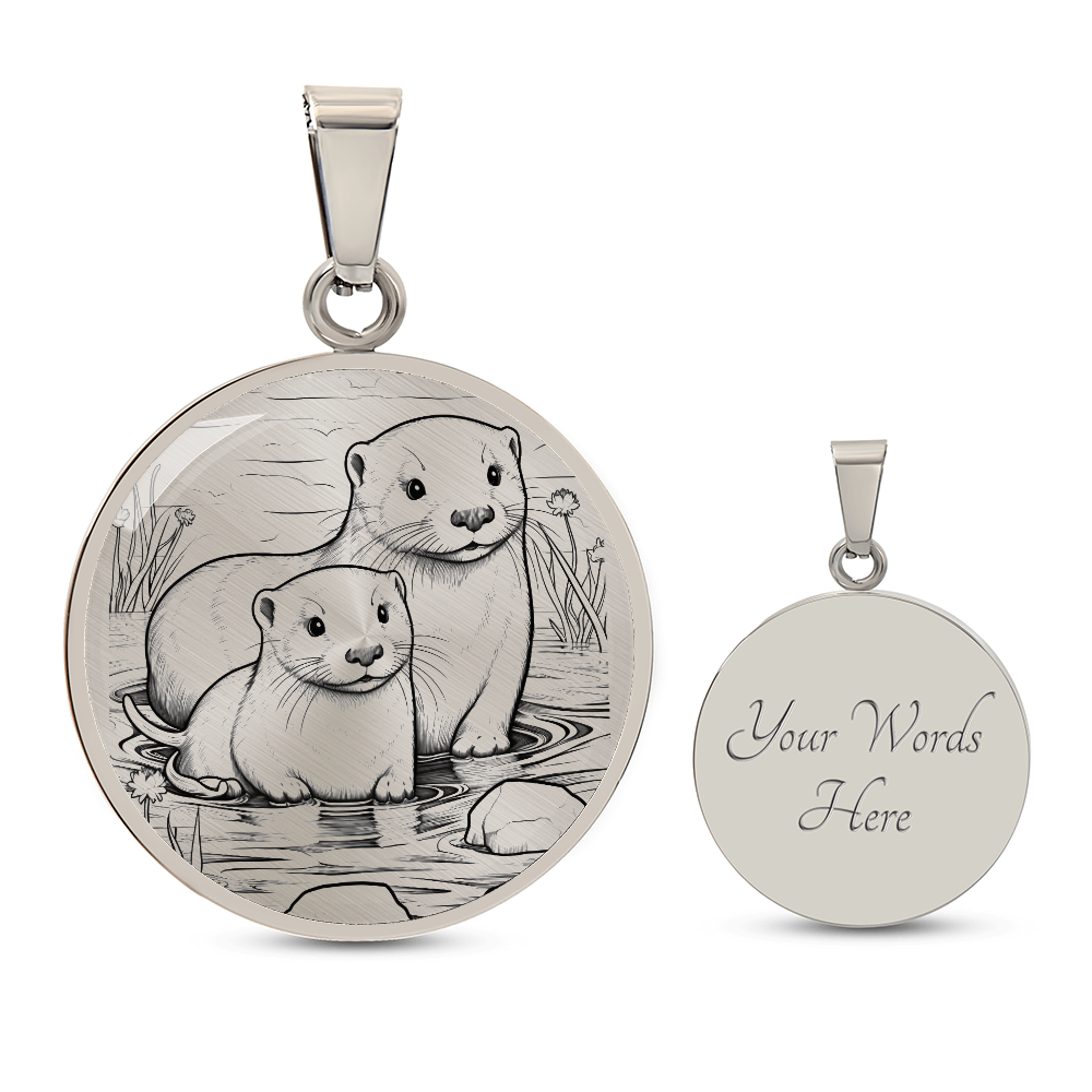 Silver Sea Otter Couple Necklace featuring two otters together in a delicate black-and-white shoreline illustration on a silver-colored pendant with engraving