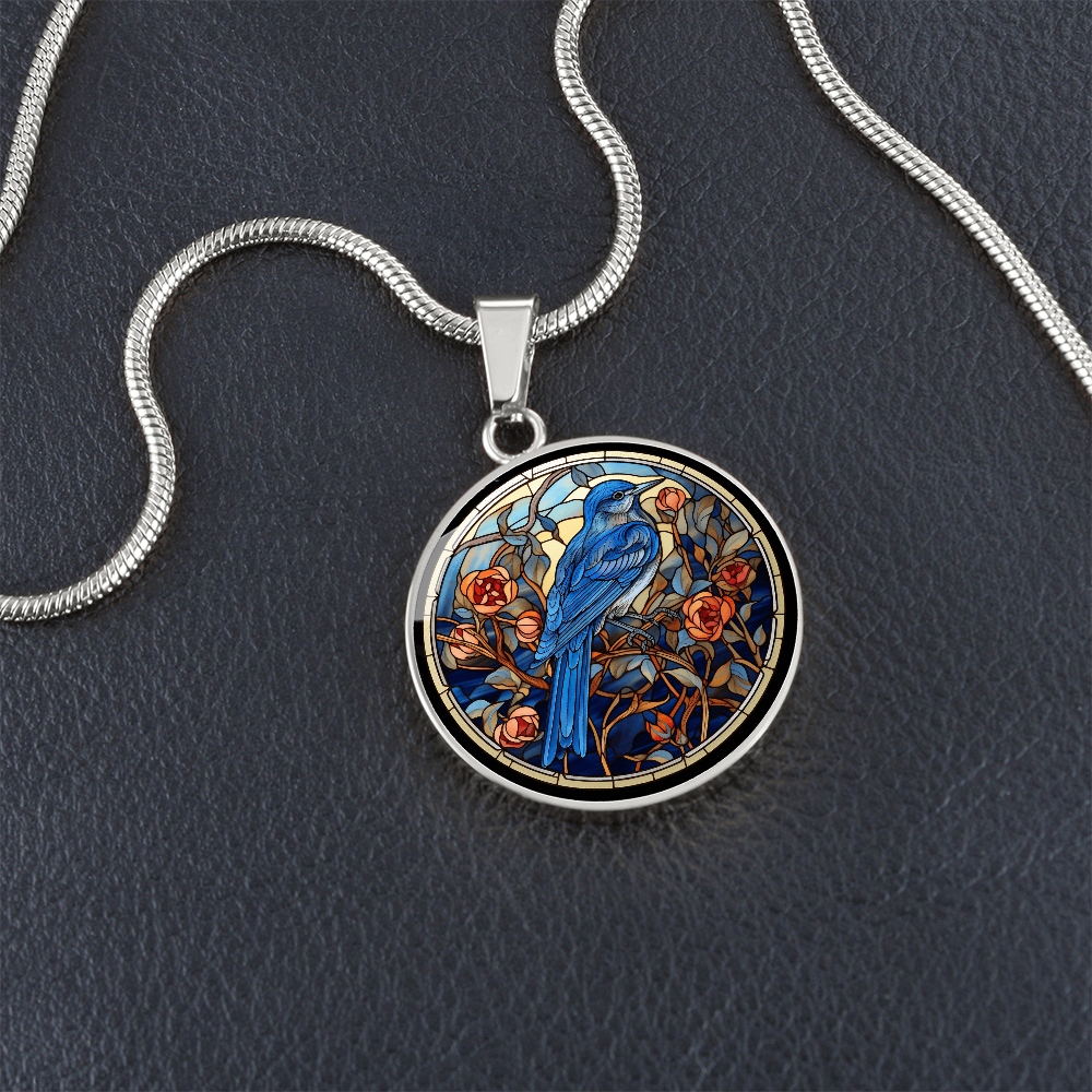 Blue Jay necklace featuring colorful cloisonné-inspired bird artwork on a round pendant, a thoughtful gift for bird lovers.
