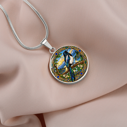 Close-up of magpie pendant featuring stained-glass-inspired design