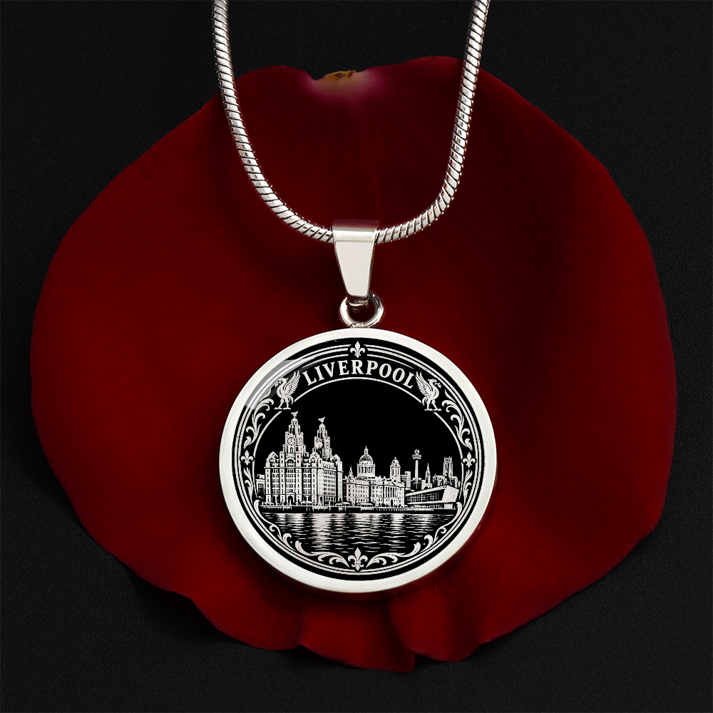 Silver Liverpool skyline necklace featuring the Royal Liver Building, historic waterfront architecture, river reflections and decorative floral border