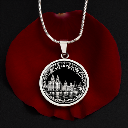 Silver Liverpool skyline necklace featuring the Royal Liver Building, historic waterfront architecture, river reflections and decorative floral border