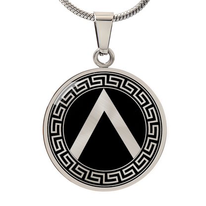 Silver Spartan shield necklace featuring ancient Greek warrior shield artwork on a circular pendant.