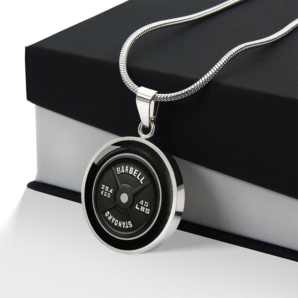 45 lb weight plate necklace with realistic black barbell plate artwork and 45 LBS 20.4 KGS markings on a round pendant with gift box